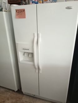 Whirlpool Side by Side Refrigerator White excellent .Warranty . Delivery available . 2203 Fowler st. Ft. Myers 33901