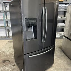 Black stainless steel Samsung Fridge Water Ice can deliver Fridge works great Has two icemakers, but only one of them works