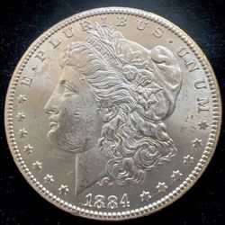 1884-CC Morgan Silver Dollar. Choice BU… 119
