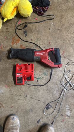 Millwaukee saw saw and dibble charger no battery bring ur own if want to test but all in working condition