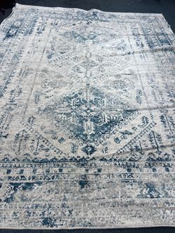 A beautiful blue and white rug 9 x 12