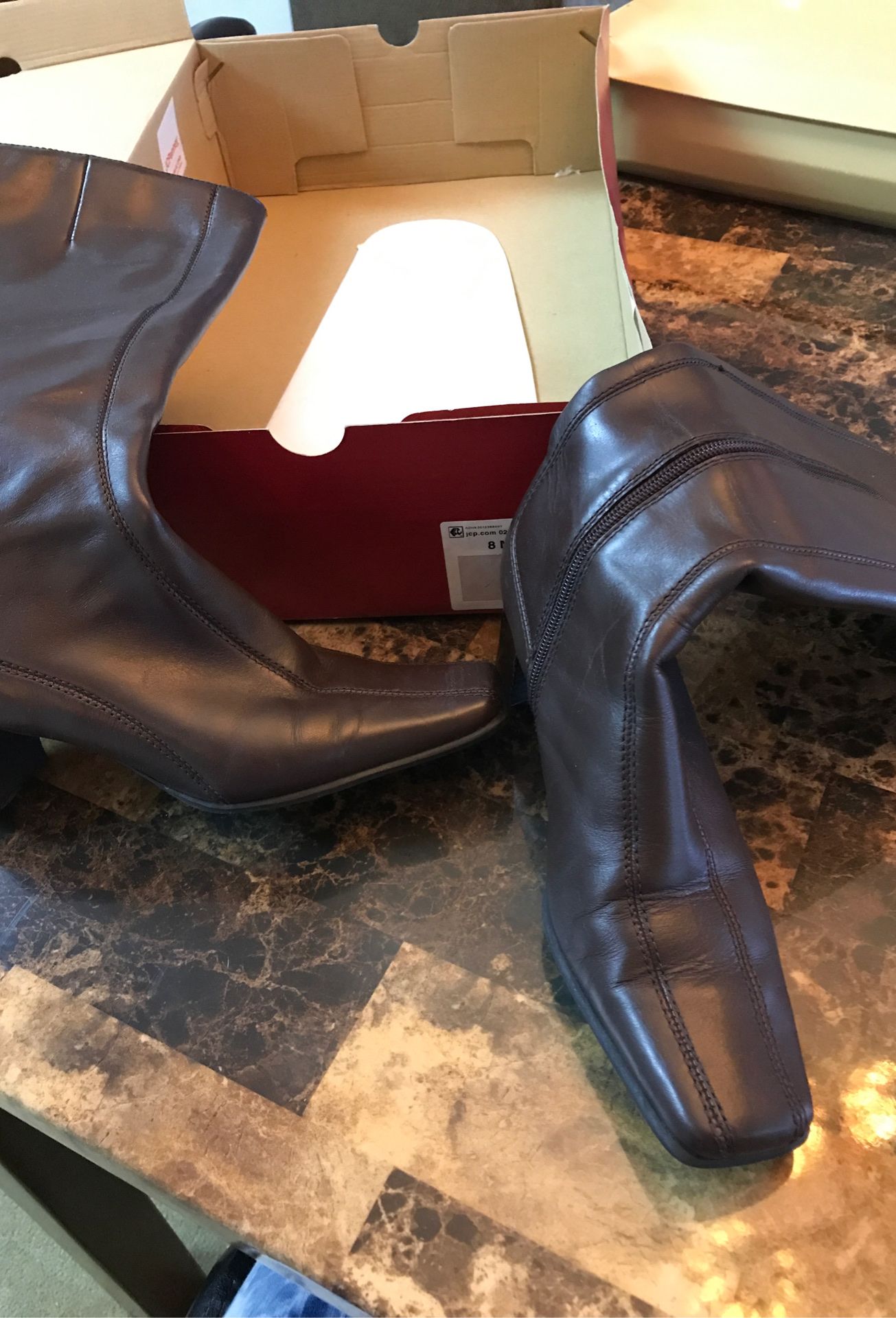 Brown leather knee high boots. 2 inch heel size 8