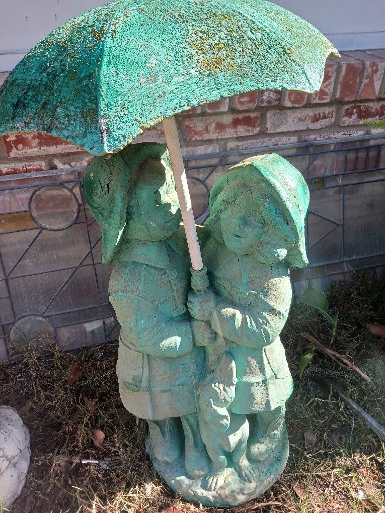 Boy And Girl With Dog Under Umbrella Statue + Fountain