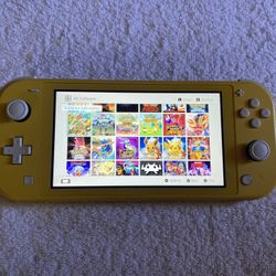 NINTENDO SWITCH LITE + 50 SWITCH GAMES POKEMON Z-A,MARIO PARTY,MARIO WONDER,MARIO KART,POKEMON ARCEUS 
