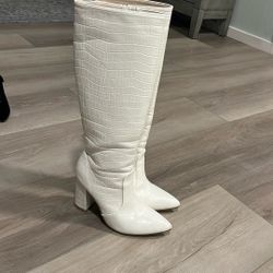 Tall white boots