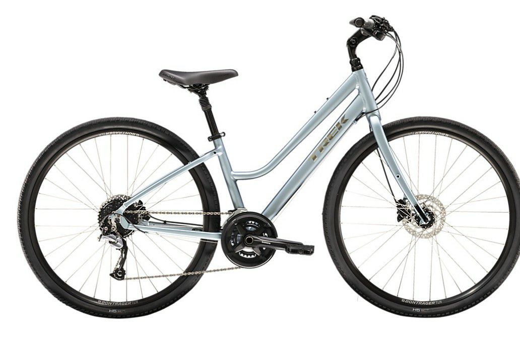 Trek his and hers bicycles with rack for bikes. Like new. Man bike is grey and black. Ladies is ue and grey. Manual available.