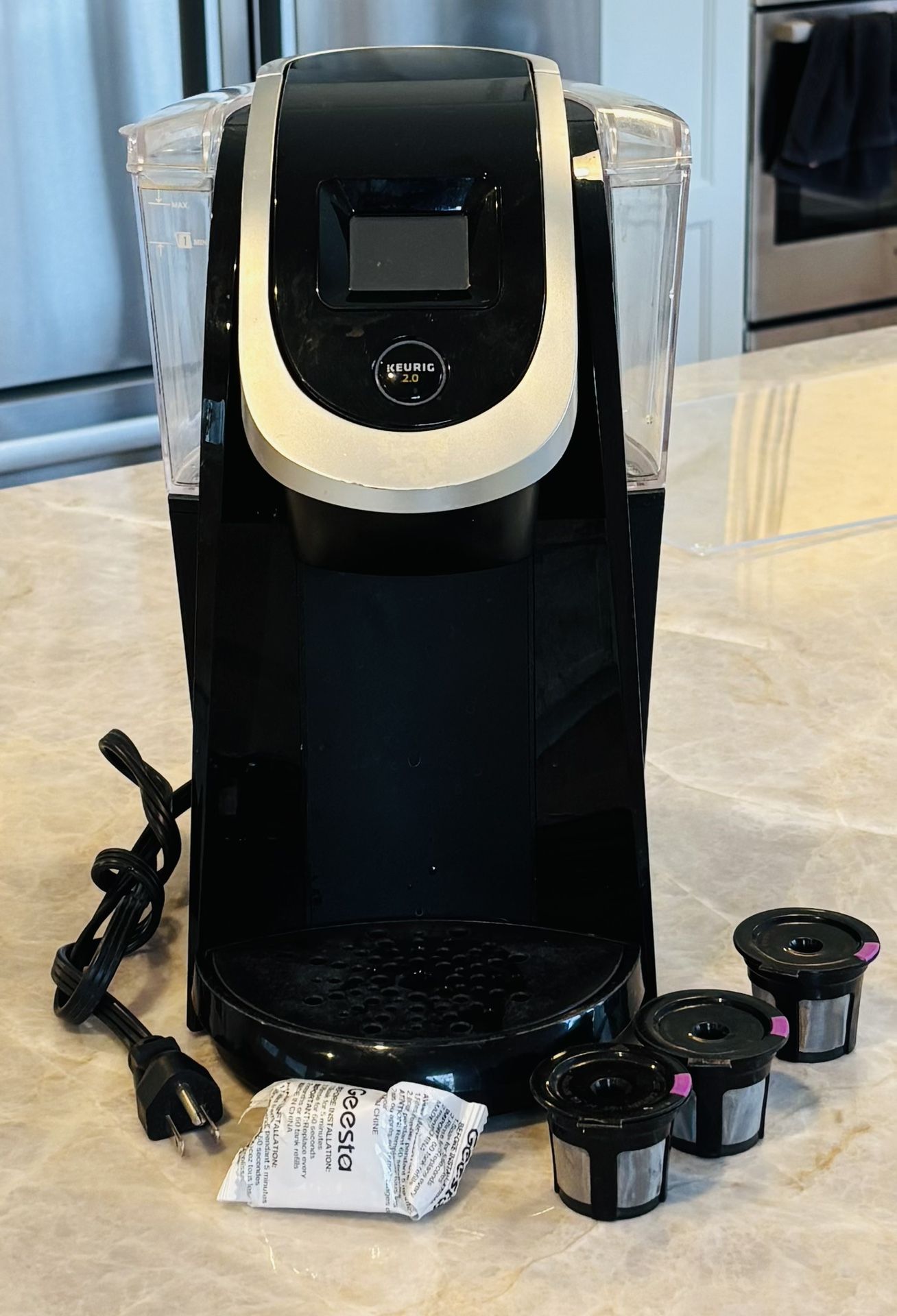 Keurig 2.0 Coffee Maker with 3 reusable pods and one fresh filter.