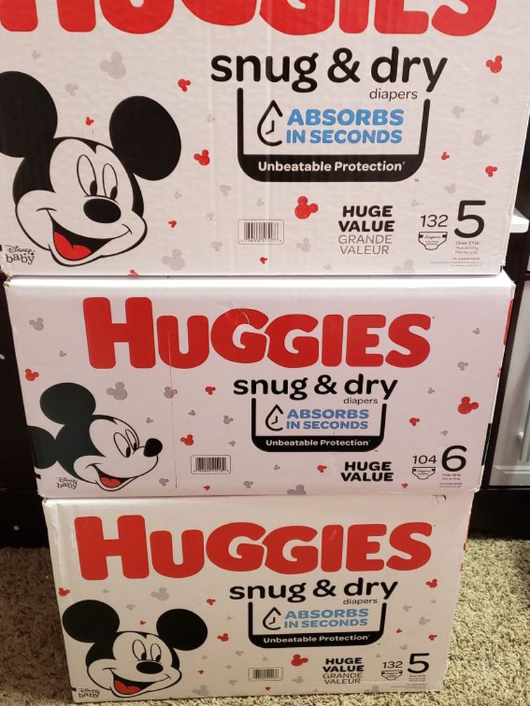 HUGGIES SNUG AND DRY BUNDLE SIZE 5-6. NEW. NEVER BEEN OPENED. PICK UP IN RIVERBANK.