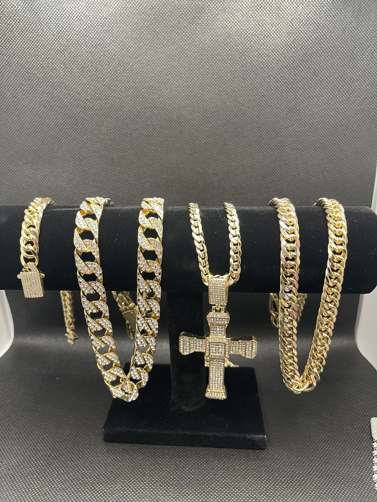 3 Gold Chains And A Bling Bracelet