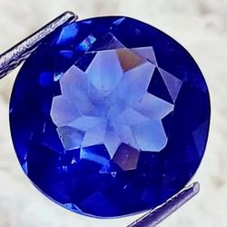 9.10 Ct Loose Blue Zoisite Tanzanite-Like Excellent Round Cut Gemstone. The product is a 9.10 carat natural loose blue zoisite tanzanite-like gemstone