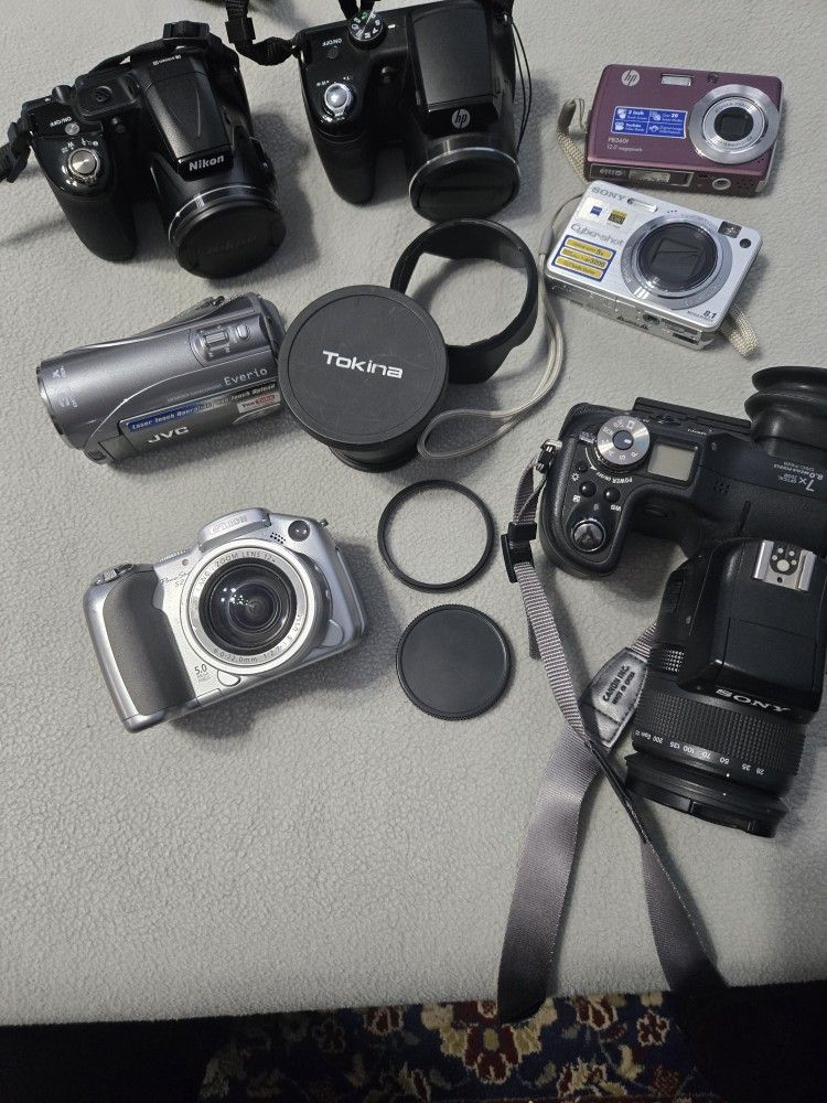 Assorted Cameras And Accessories