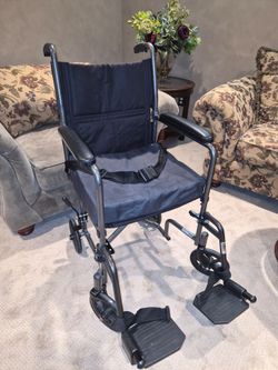 Transport Chair, Black, foldable, with padded seat & foot rests