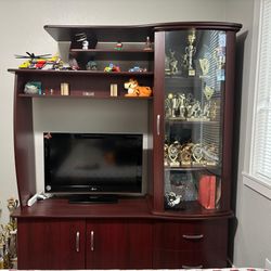 Dark wood entertainment center with display cabinet
