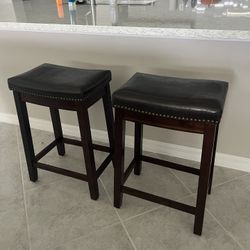 Two Dark Brown Saddle Chairs - Counter Height. (24inches)