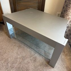 Silver TV stand with glass shelves