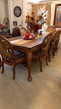 All wood six and eight seater dining table with chairs