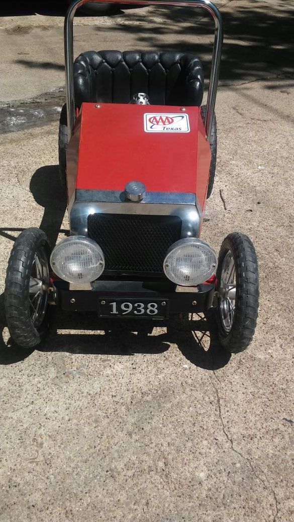 Vintage 1938 red model T child ride pedal car