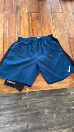 blue and black nike pro shorts, small