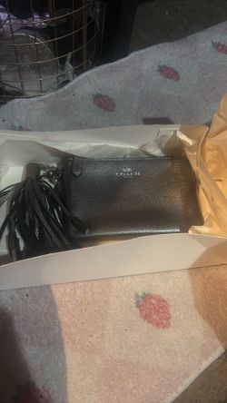 Coach hand purse with iphone usb charger attached