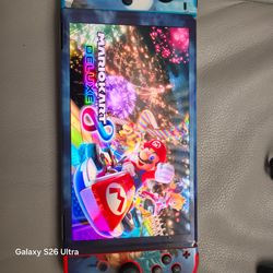 Nintendo switch oled with DragonBall Z skin with Mario kart 8