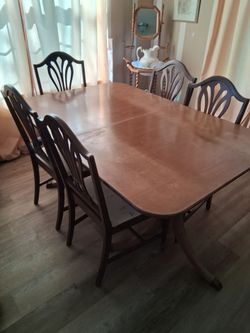Antique pedestal table and chairs