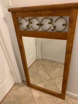 Mirror with decorate wood frame