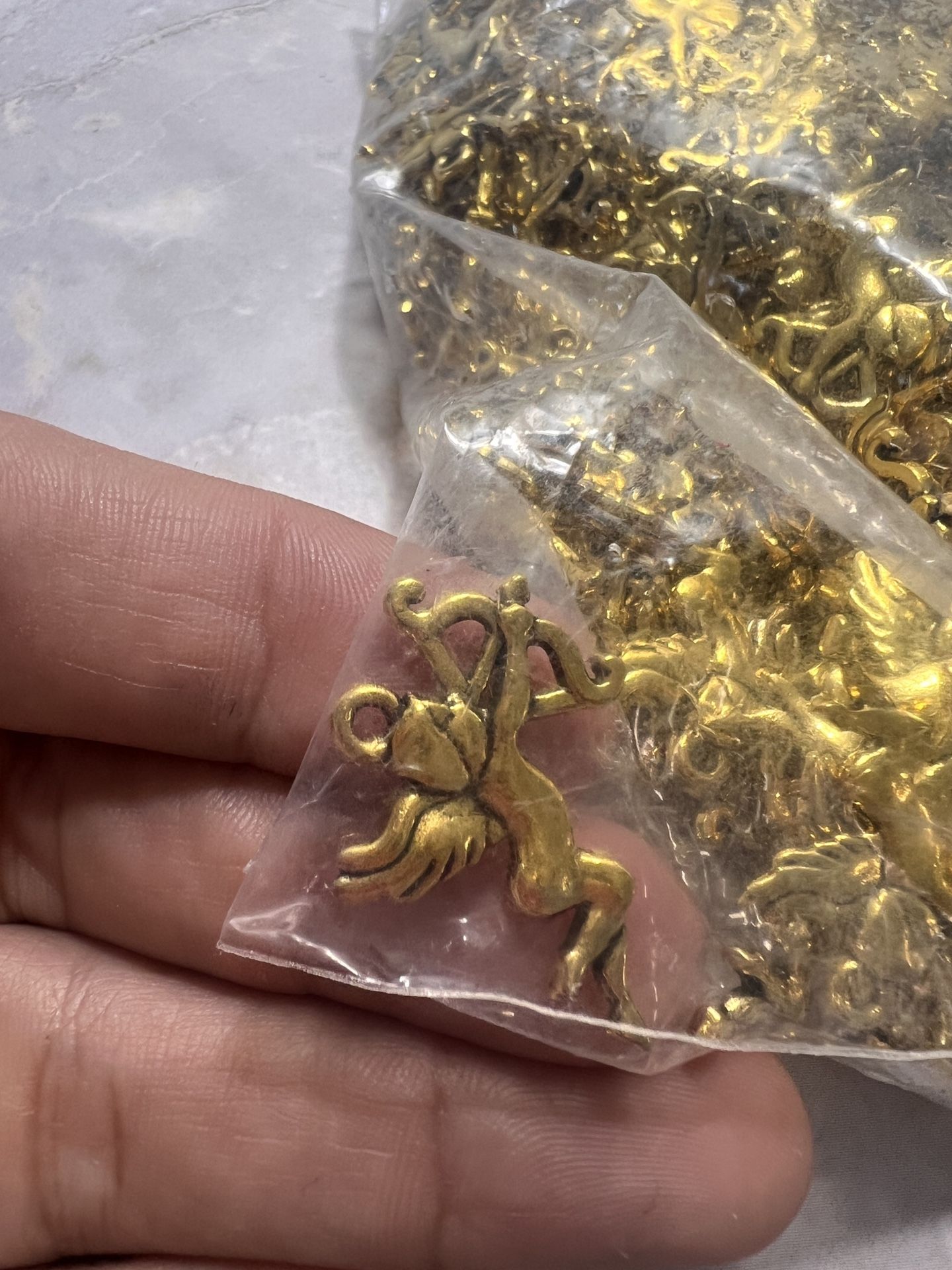 cupid-shaped necklace charms