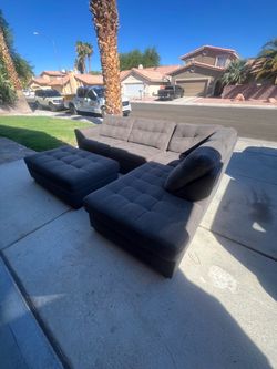 Grey sectional couch with ottoman