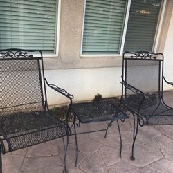 Two Wrought Iron Chairs And Small Table