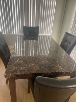 Marble top dining table with chairs
