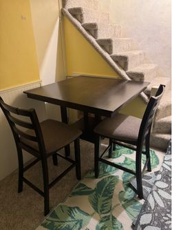 Two seat table ( room for 4 if you get more bar height chairs )