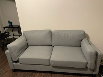A two seater gray couch