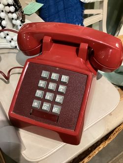 Red “hotline” vintage landline touch tone phone