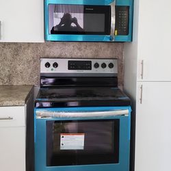 New stove and microwave, still with their protective covers. both $ 600