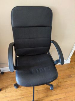Black desk chair with wheels in excellent condition.