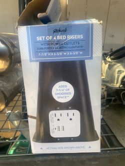 Bed risers with power outlets