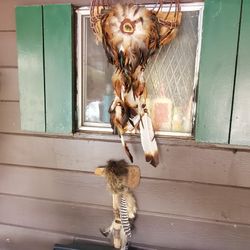 Vintage Tommy Hawk and basket with feathers