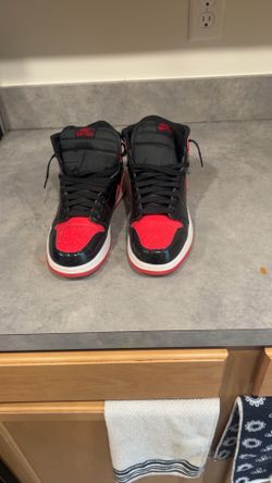 High top Jordan’s 1’s red black and white flag