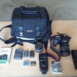 Canon EOS 50D, 28-135mm Lens, 18-55mm zoom Lens, UV lens filter, 430 EX Speed light, 2 & 8 GB compact flash card, extra battery, Canon camera bag