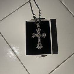 Fully iced out diamond medieval cross made out of VVS1 Moissanite with a silver rope chain