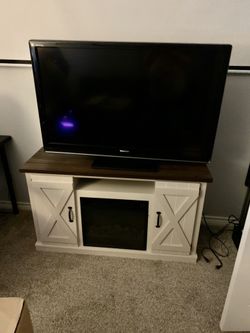 Tv stand/entertainment center w/ electric fireplace