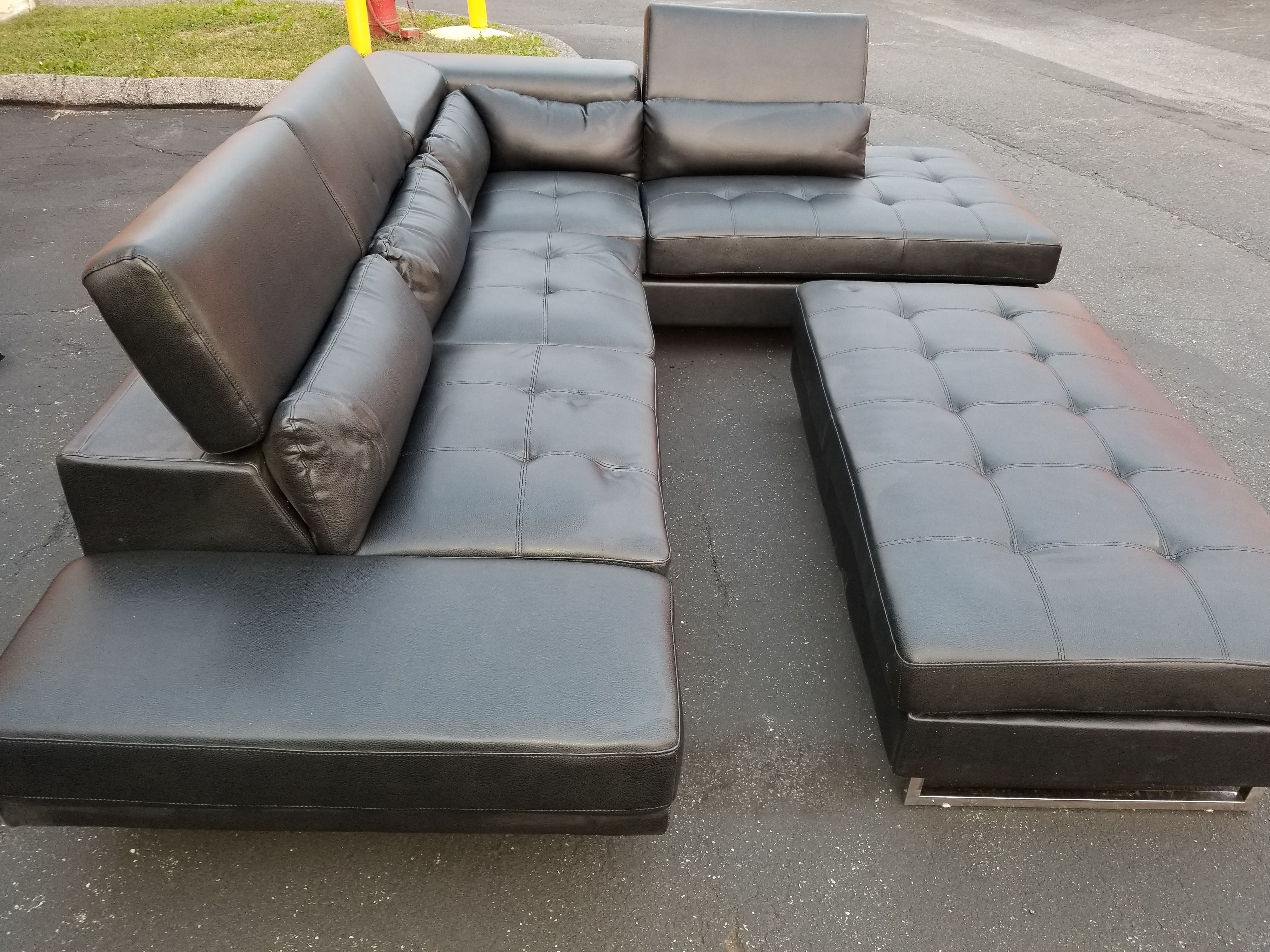 Black Leather sectional and ottoman