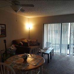 Wooden dining table (4 chairs) + sofa