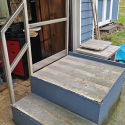 Set of solid stairs with stainless steel handrail from Weyerhaeuser