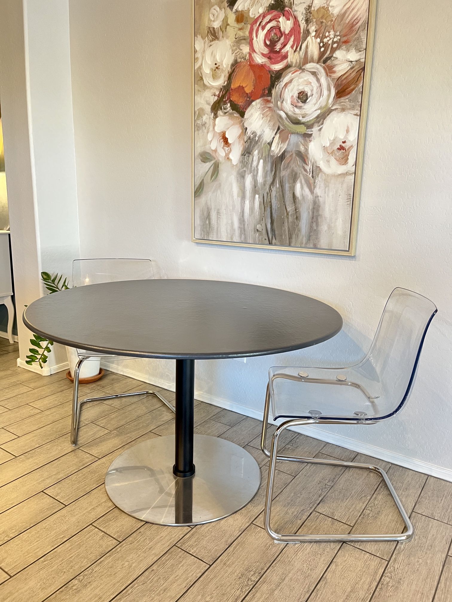 Sleek Round Dining Table With Stainless Steel Base Dining Table, Two Acrylic Chairs