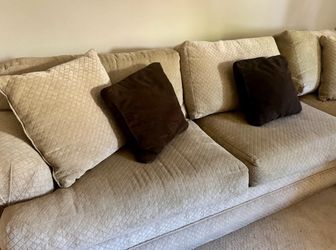 Traditional L-shaped sectional sofa with plush upholstery and throw pillows 95 x 80 x 34" seat depth