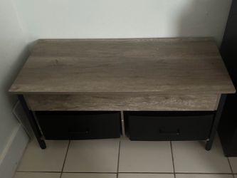Coffee table with storage top and 2 storage bins