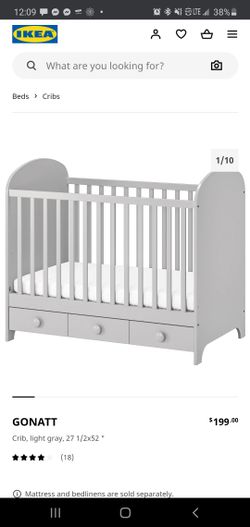 Ikea baby crib, changing table and wardrobe.