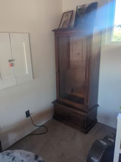 Real wood vintage display case. Glass door.