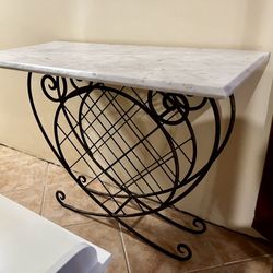 Vintage wrought iron wine rack with marble top
